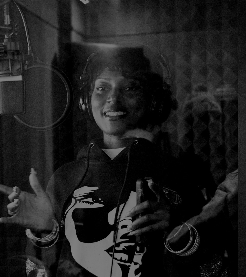 Artist smiling in the recording booth