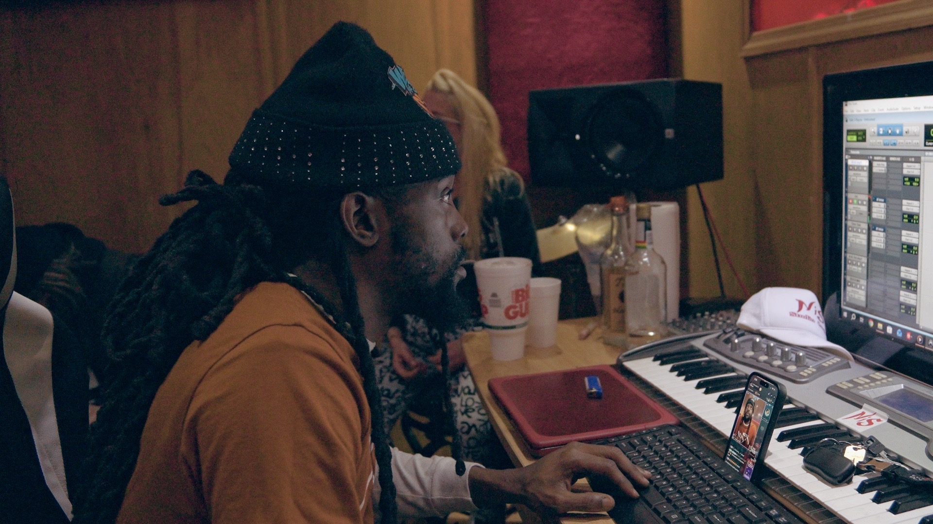 Bizz Da Collector working at the studio computer and console