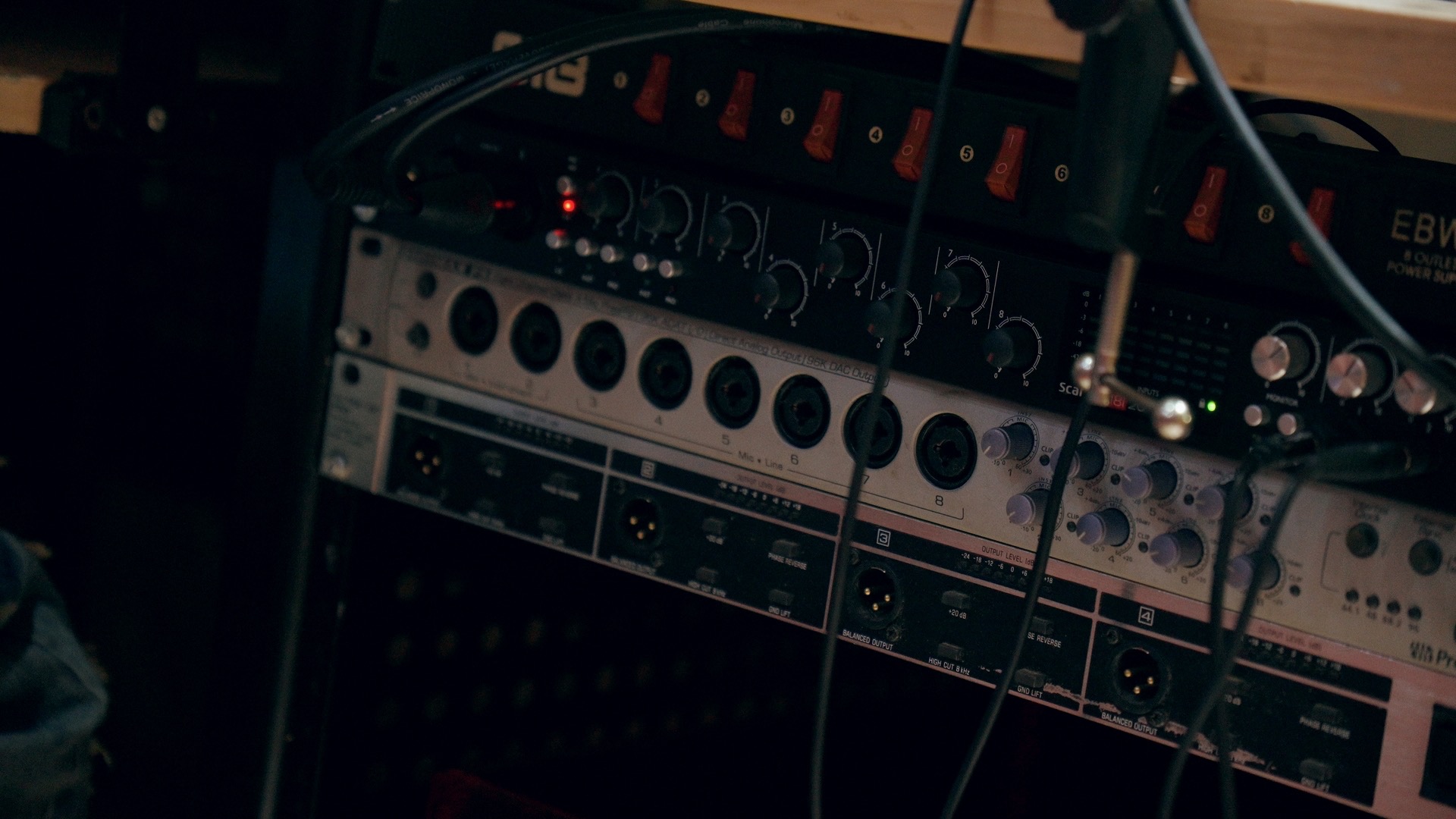 Close-up of studio audio knobs and equipment